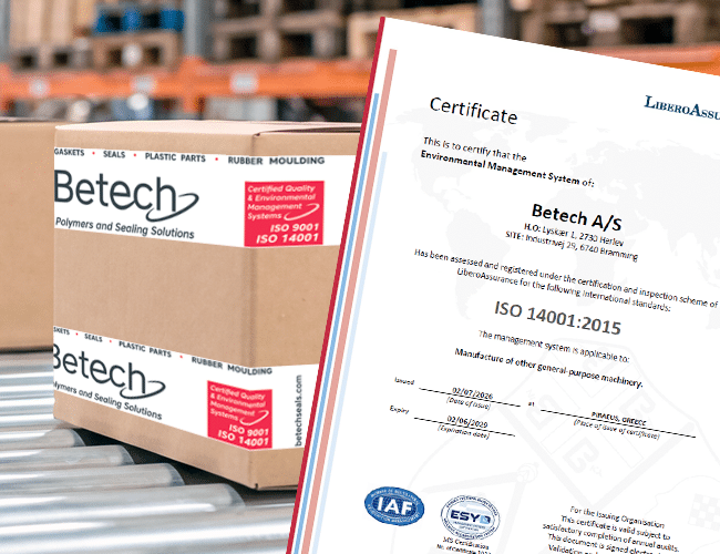 Betech papkasse ved siden af ISO 14001:2015 certifikat.